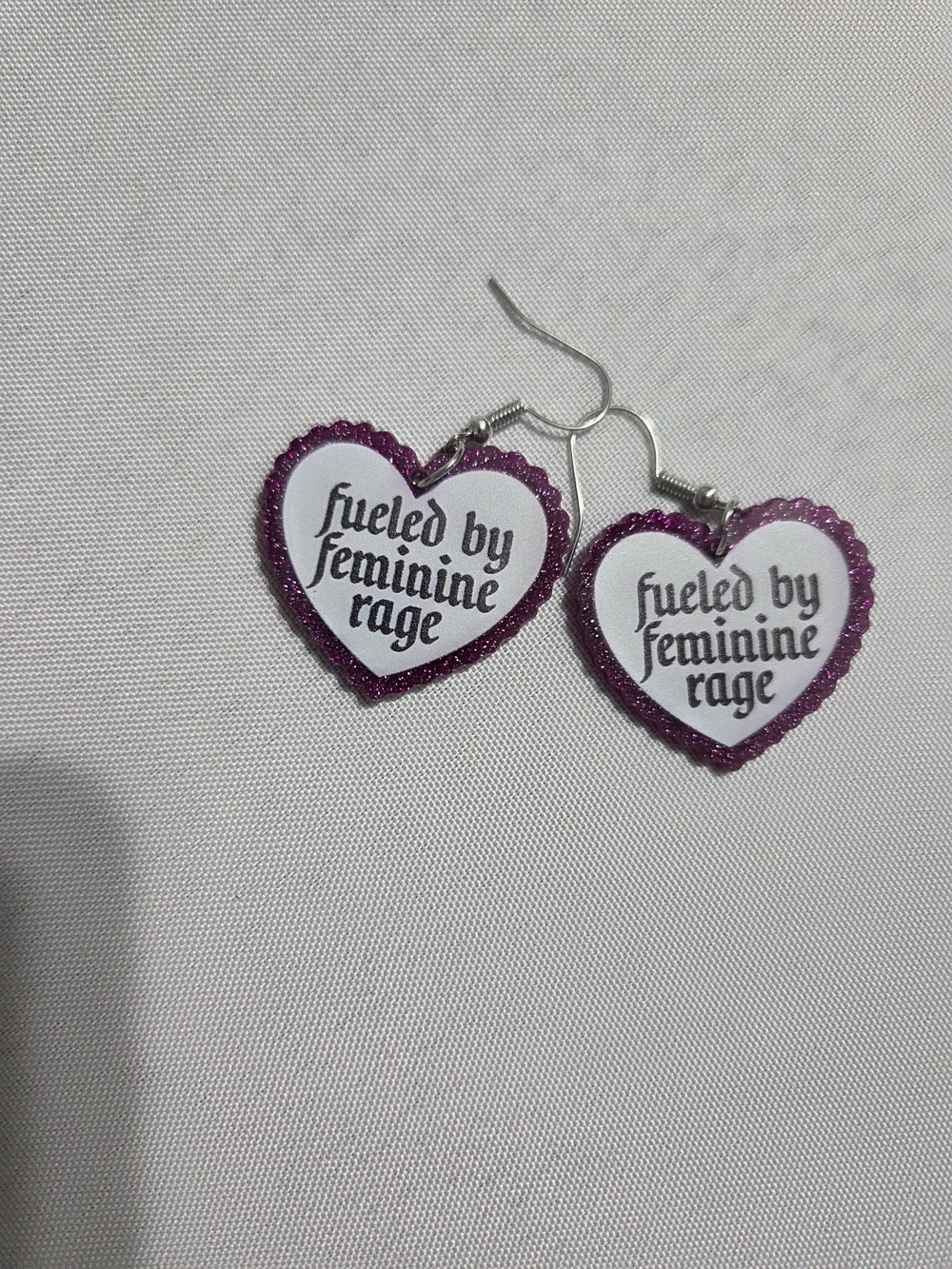 Heart Dangle Earrings - Pink 'Fueled by Feminine Rage' NEW CAME IN PLASTIC.